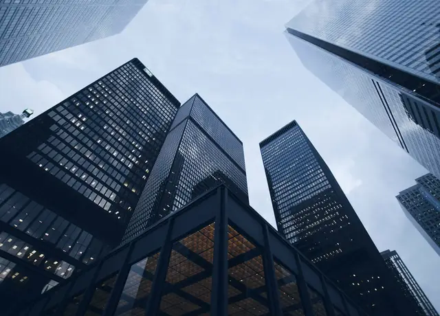 Glass office towers seen from street level