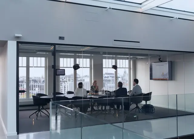 A glass-walled meeting room